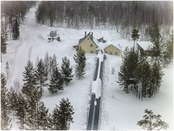 Tower station in March 2015. The station consists of an air conditioned bunker for scientific equipment and living houses. The pergola connects the house with the base of the tower so that the staff is protected against falling ice.